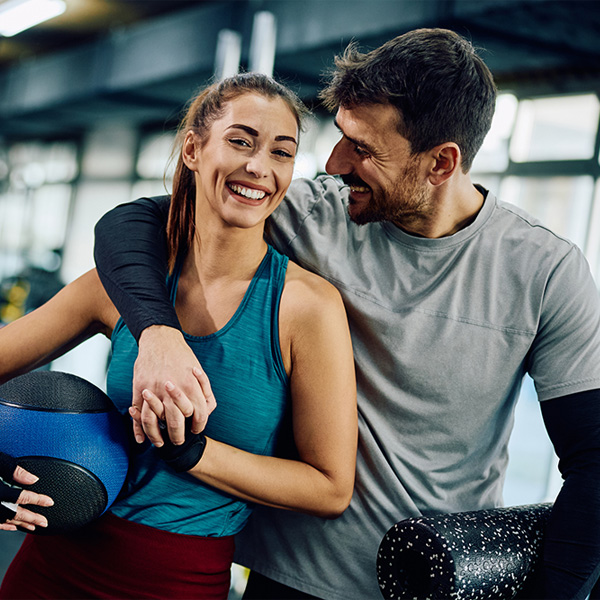 happy couple at the gym